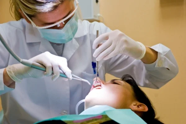 A registered dental hygienist in clinical practice